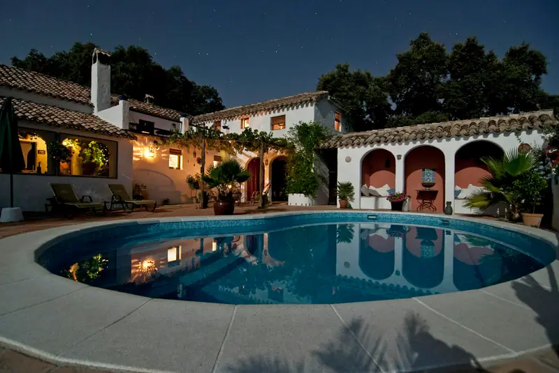 Farmhouse with pool at dusk