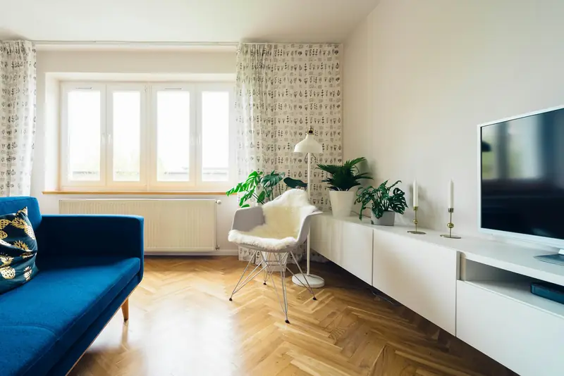 Herringbone wooden flooring in a bright living room