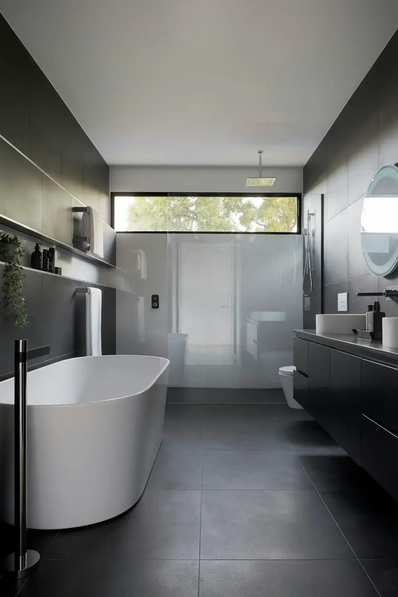 Modern bathroom with concealed plumbing, walk-in shower and freestanding tub