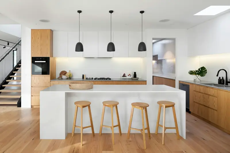 Island kitchen with wood tones