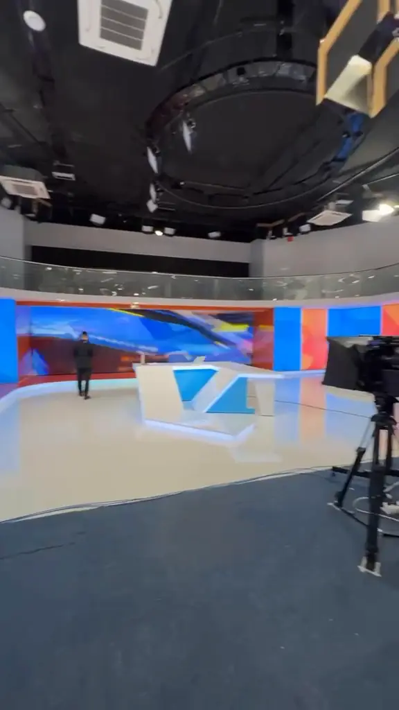 Cameras, set and lighting from the studio floor.